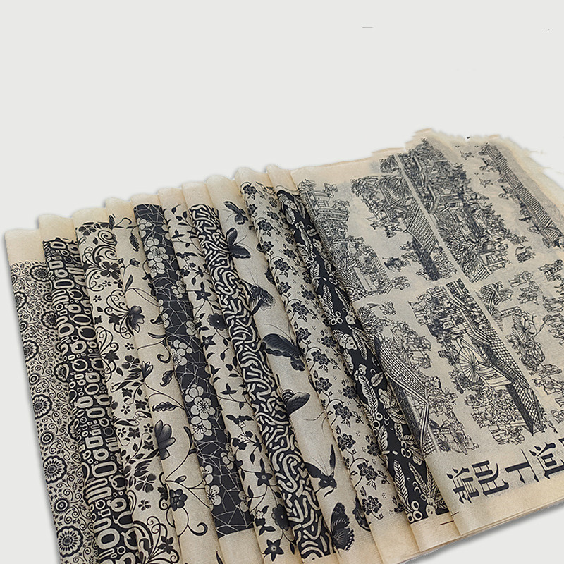 Black underglaze floral sticker with butterfly and flower designs.